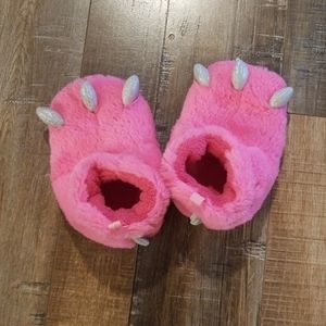 Pink and glittery dinosaur slippers